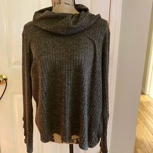 Turtleneck sweater with button detail on sleeve